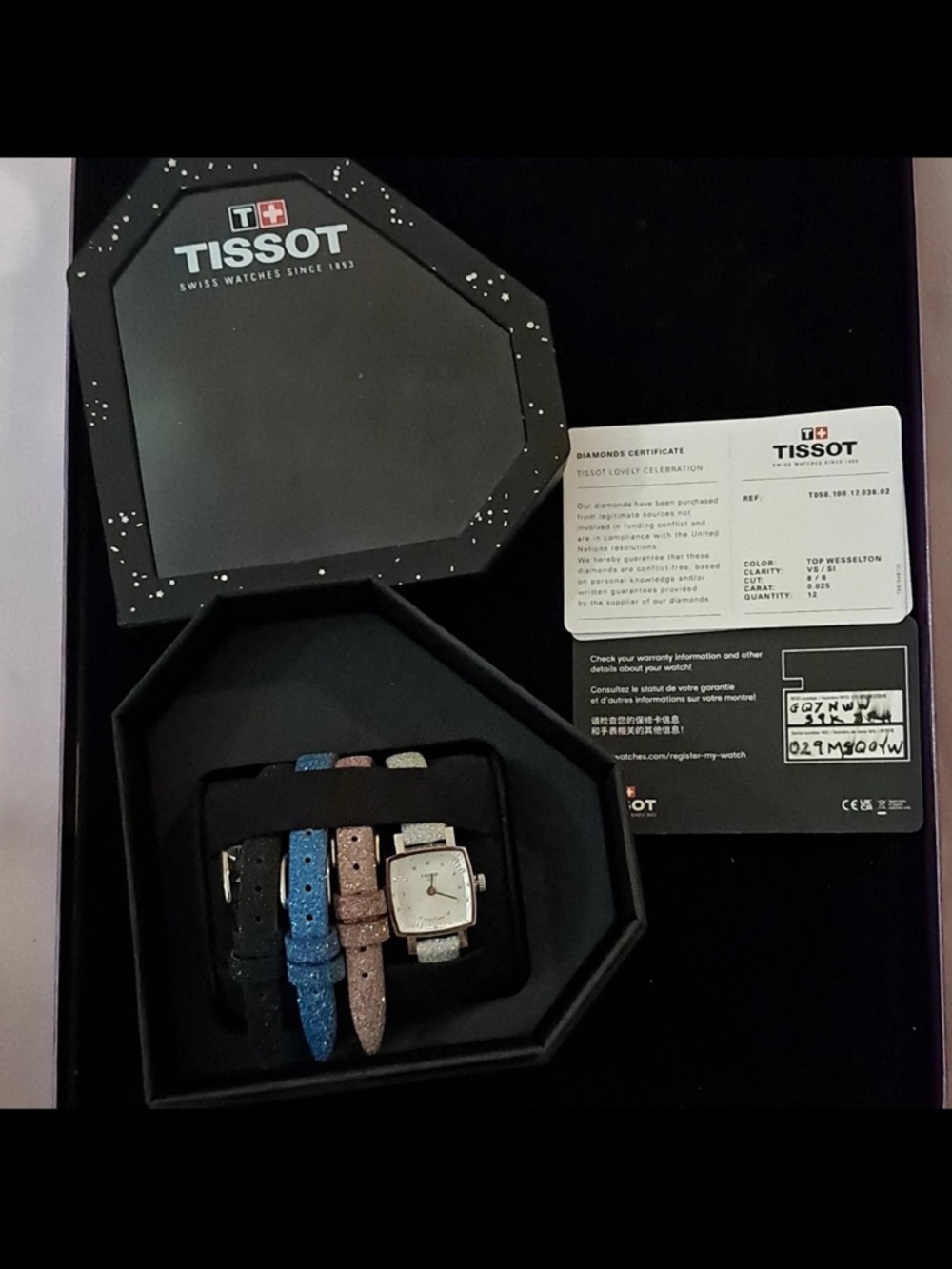 Tissot Women's Silver Dial Watch with Black, Blue, and Pink Straps
